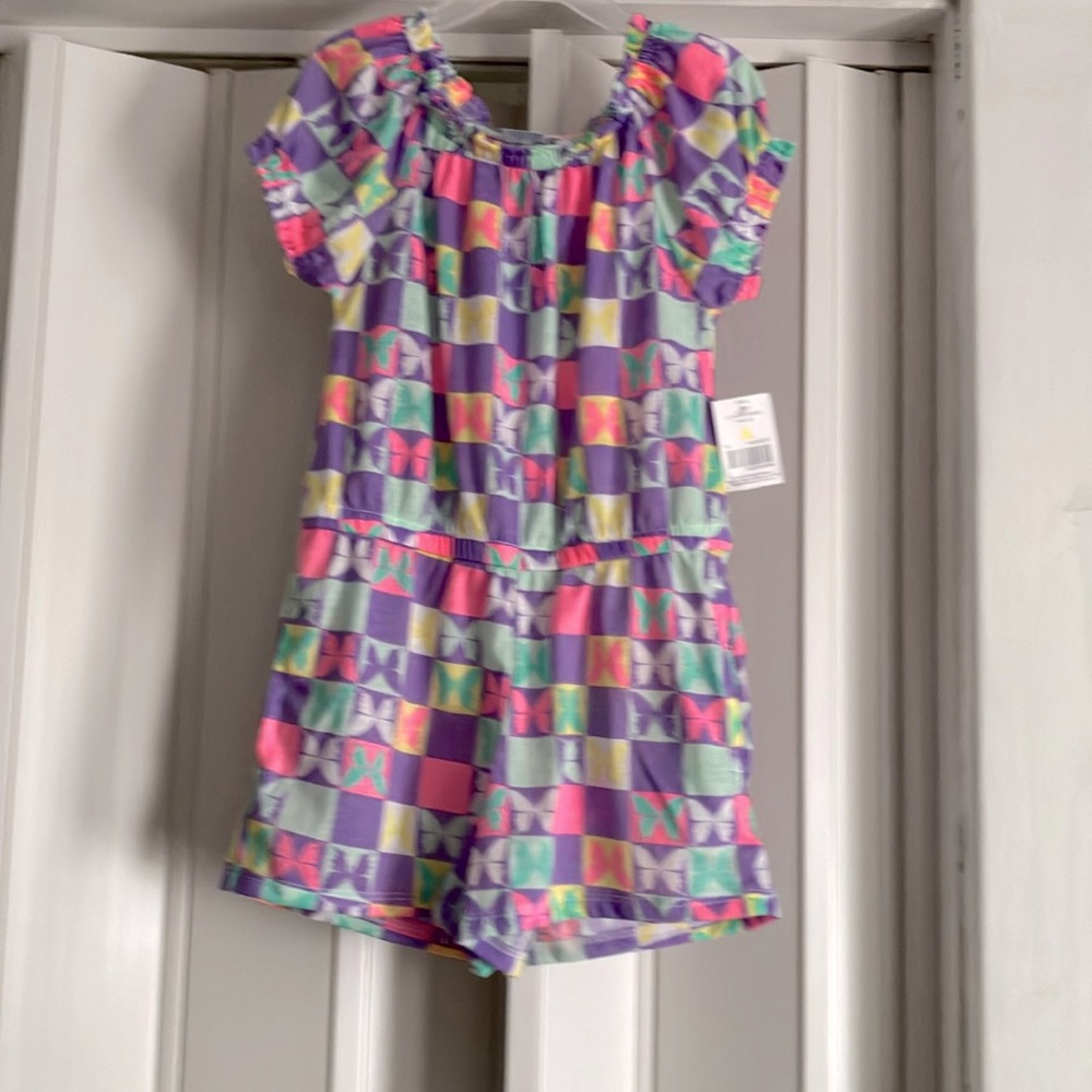 Brand new, girls size 6x one piece romper.